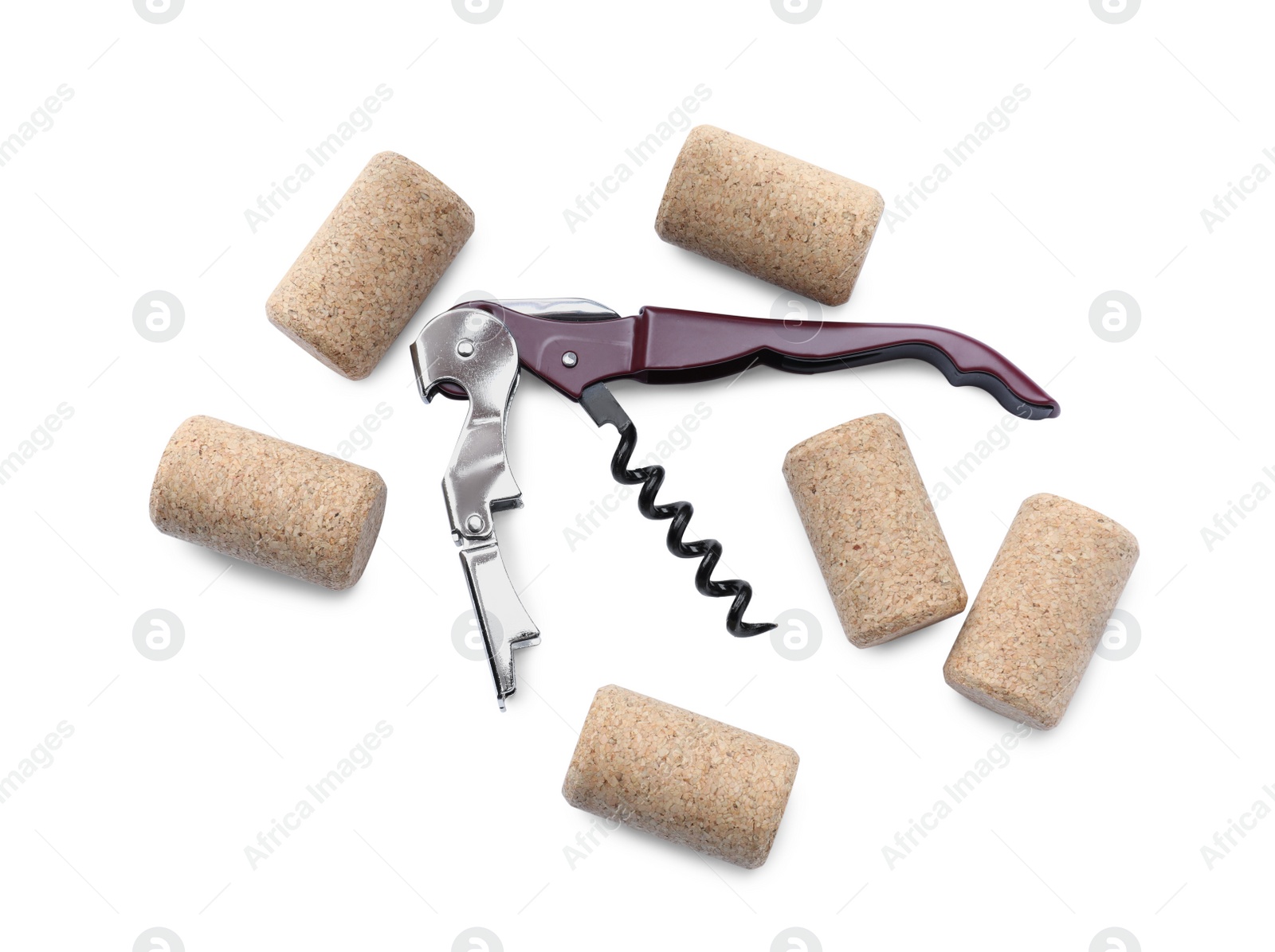 Photo of Corkscrew and wine bottle stoppers on white background, top view