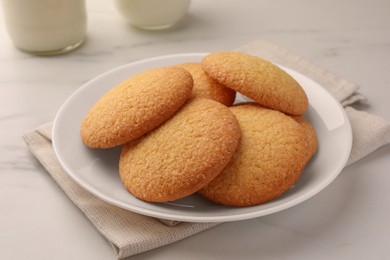 Delicious Danish butter cookies on white marble table, closeup