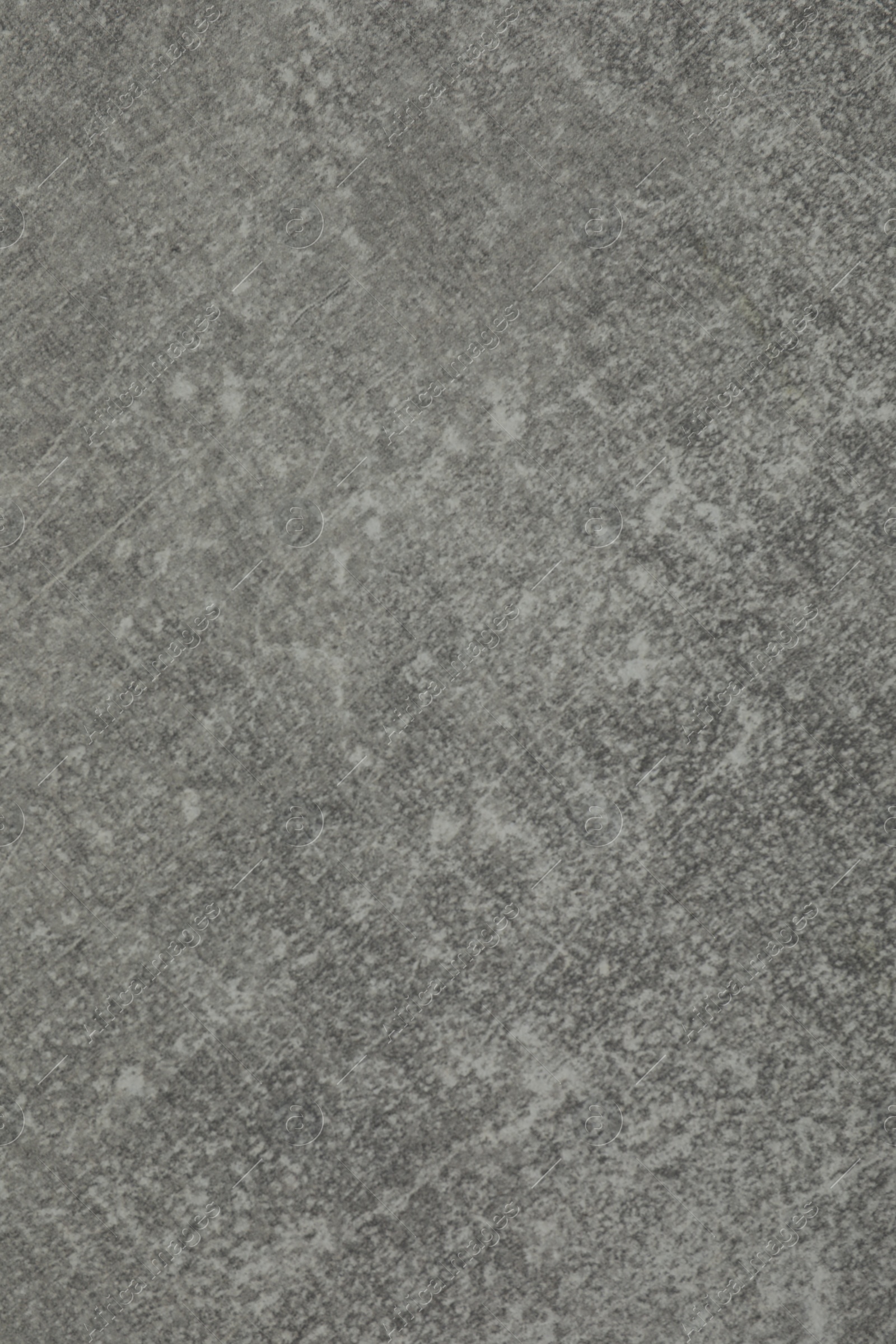 Photo of Texture of light grey stone surface as background, closeup