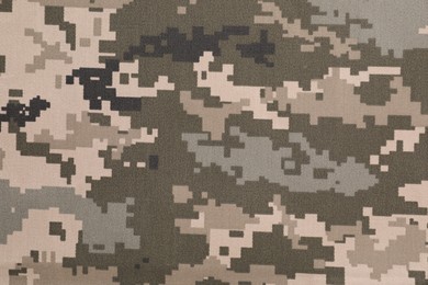 Texture of camouflage fabric as background, top view