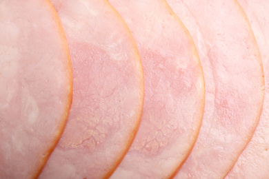 Photo of Slices of tasty fresh ham as background, top view