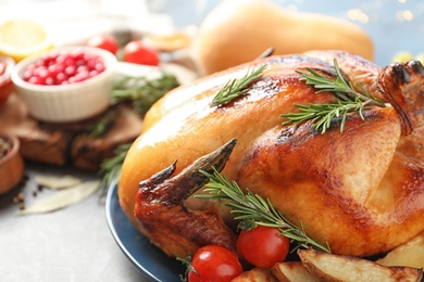 Photo of Delicious roasted turkey on table, closeup. Space for text