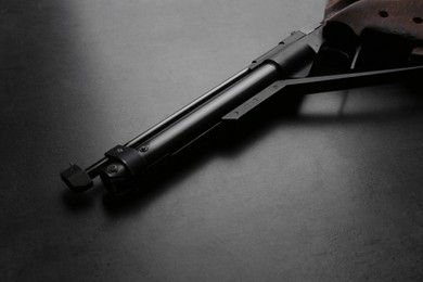 Photo of Sport pistol on black table. Professional gun
