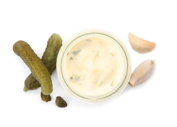 Tartar sauce and ingredients on white background, top view