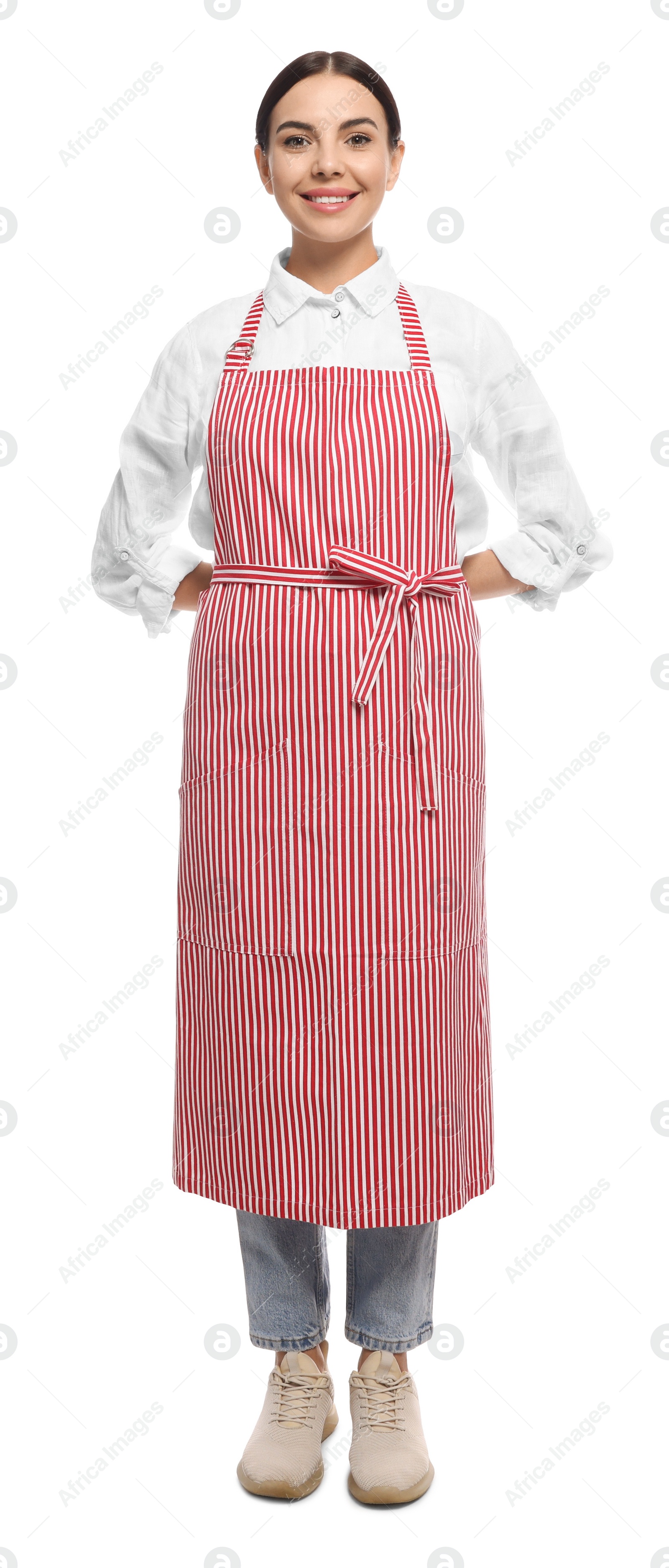 Photo of Young woman in red striped apron on white background