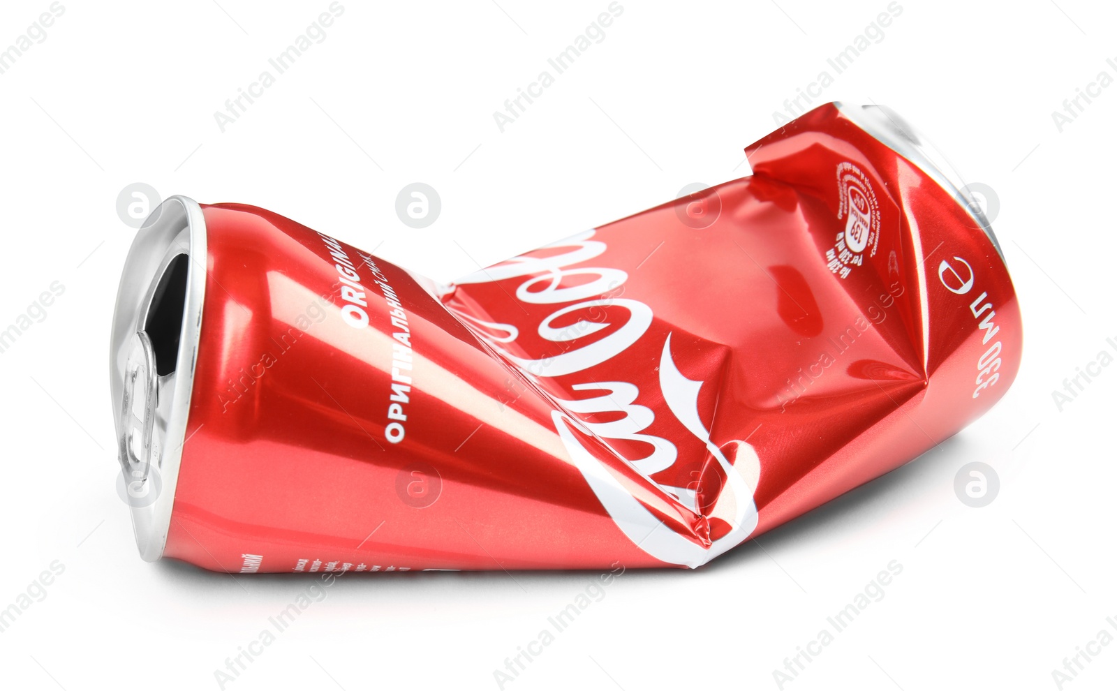 Photo of MYKOLAIV, UKRAINE - NOVEMBER 15, 2018: Crumpled Coca Cola can on white background