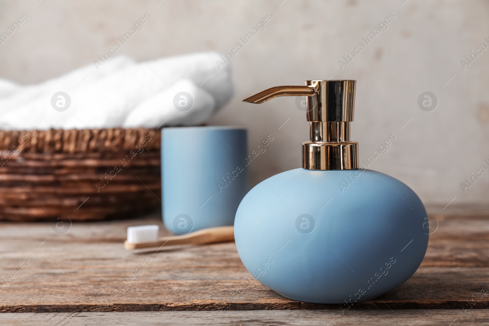 Photo of New stylish soap dispenser on table. Space for text