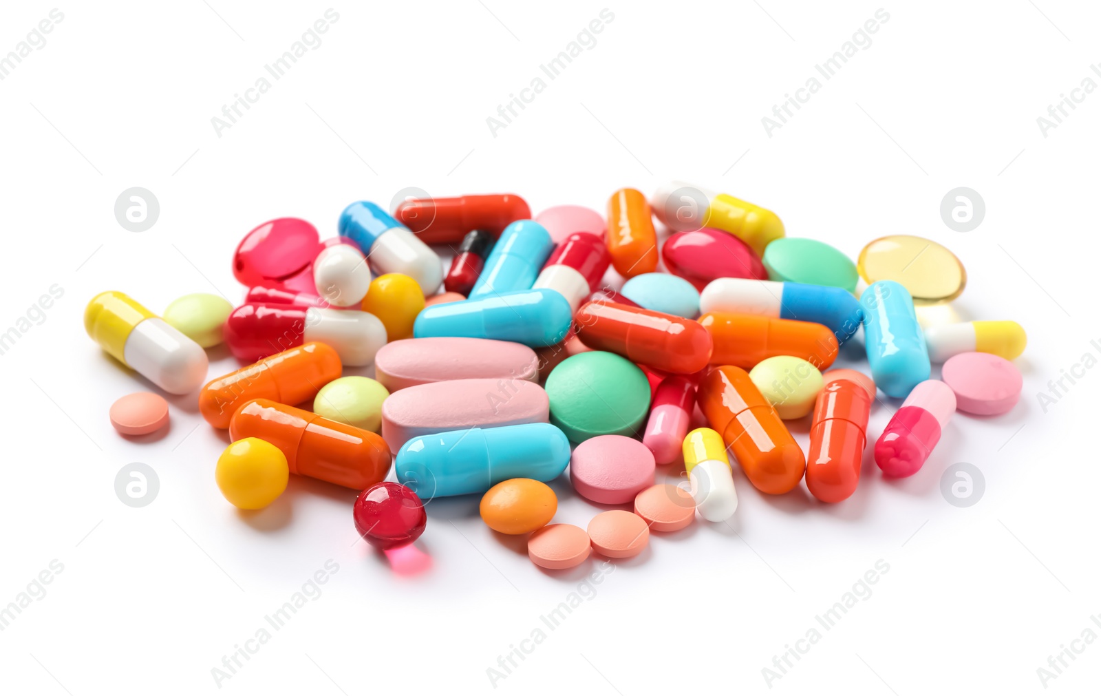 Photo of Pile of different colorful pills on white background