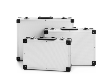 Photo of Set of modern suitcases on white background