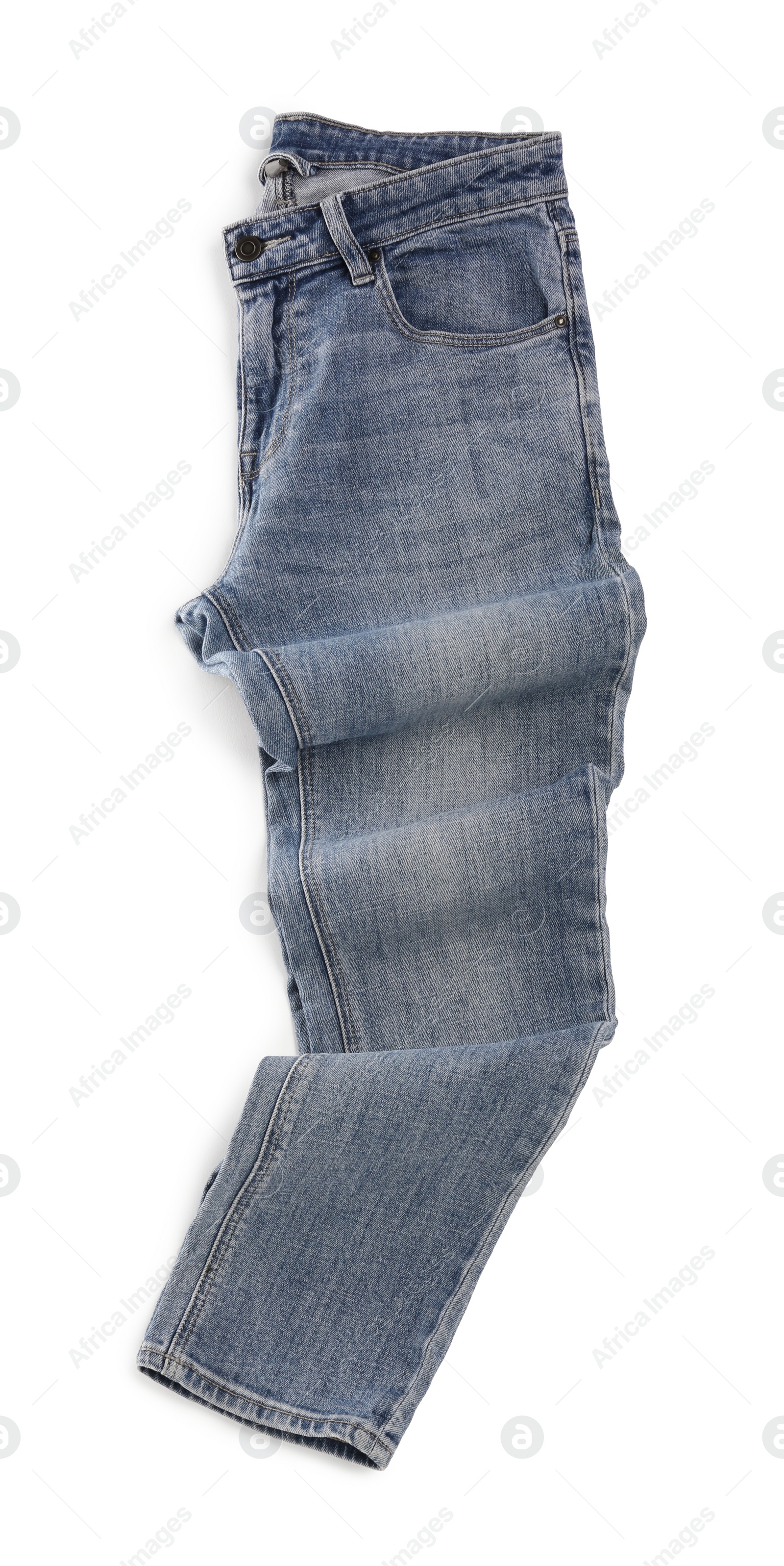 Photo of Stylish light blue jeans isolated on white, top view