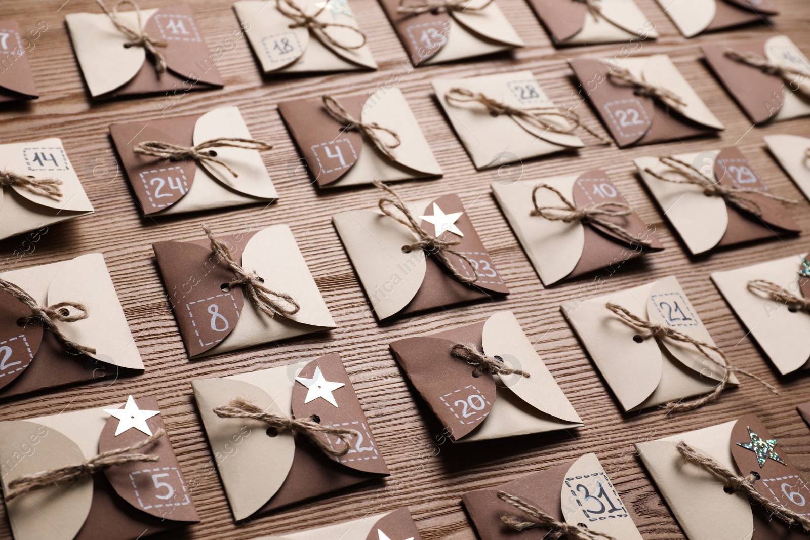 Photo of New Year advent calendar with gifts on wooden background