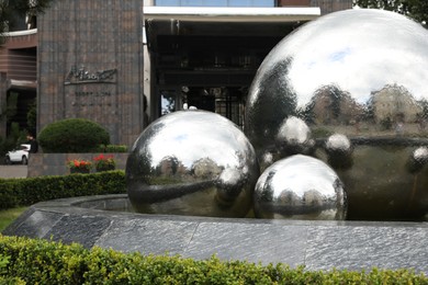 Photo of Truskavets, Ukraine - July 22, 2023: Beautiful fountain on city street, space for text