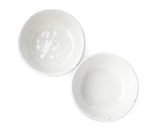 Beautiful empty ceramic bowls on white background, top view