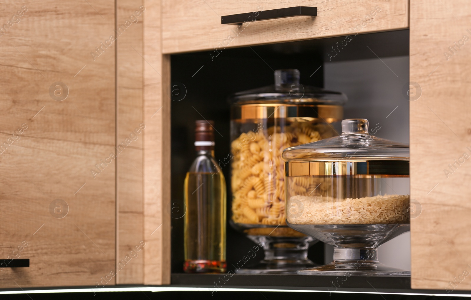 Photo of Shelf with raw cereals in modern kitchen