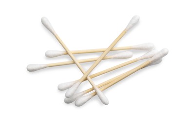 Photo of Wooden cotton buds on white background, top view