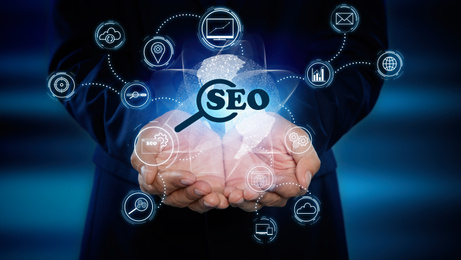 Image of Man demonstrating directions of SEO. Icons of keyword research, customization and others