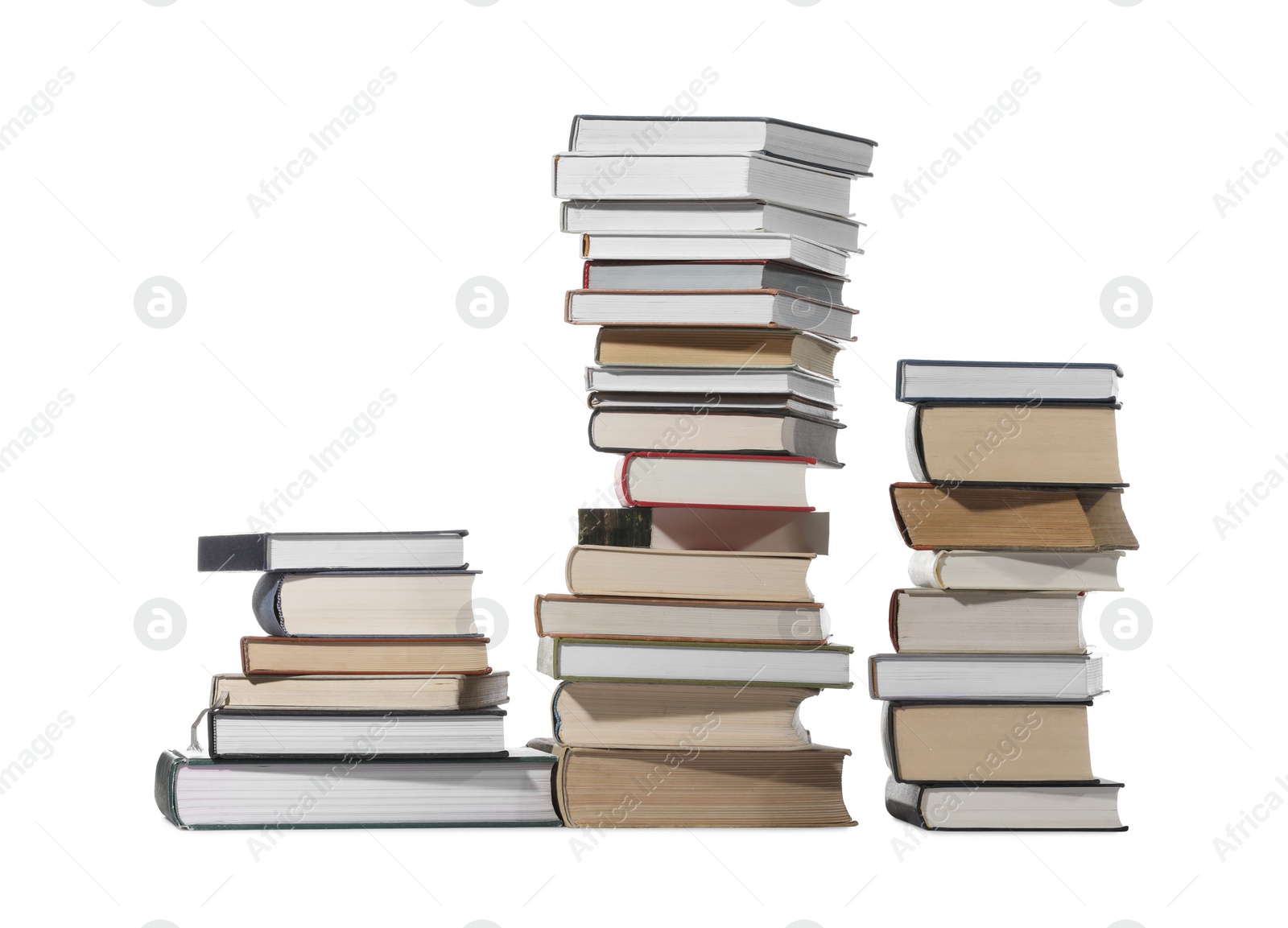 Photo of Stacks of many different books isolated on white