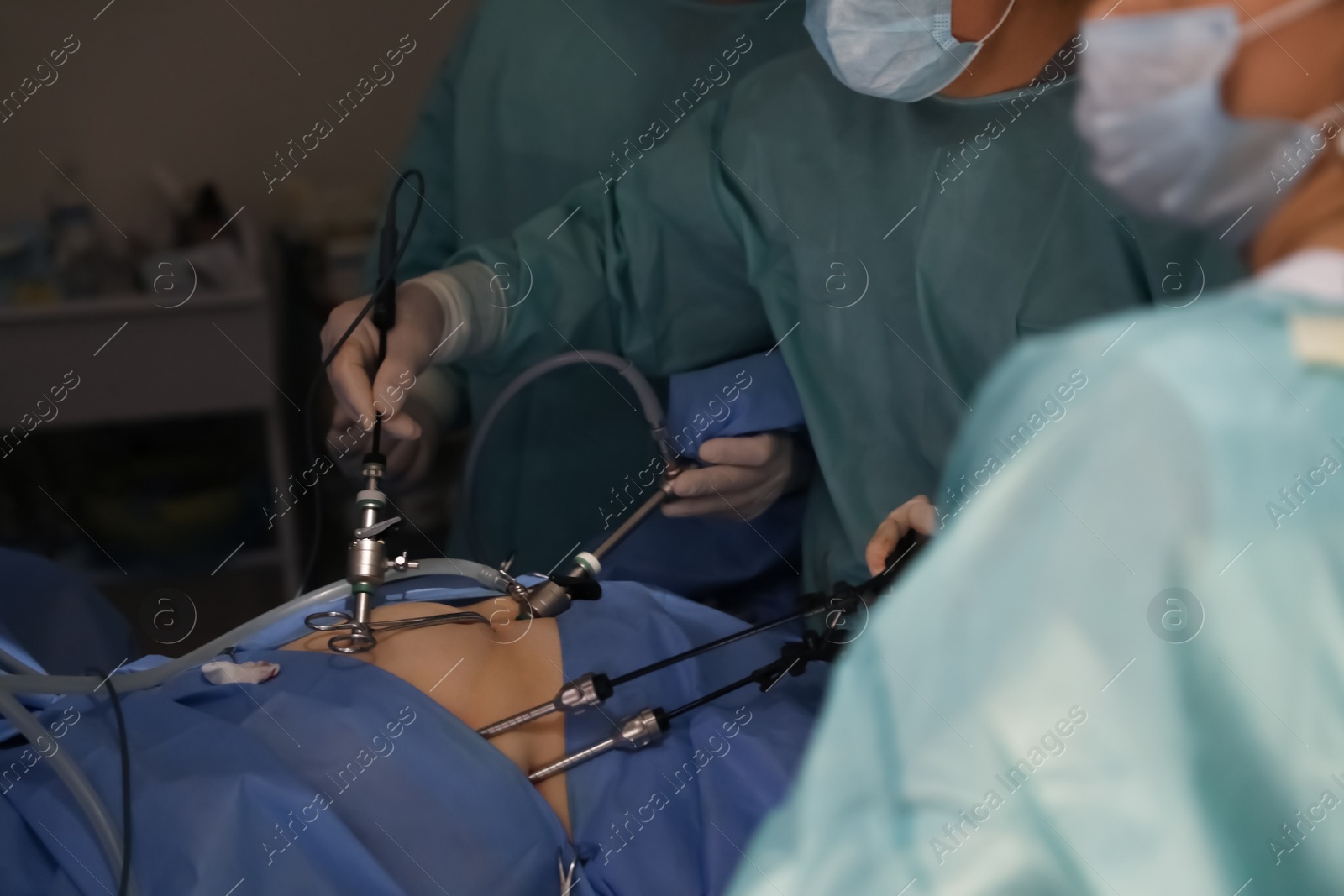 Photo of Medical team performing surgery in operating room, closeup