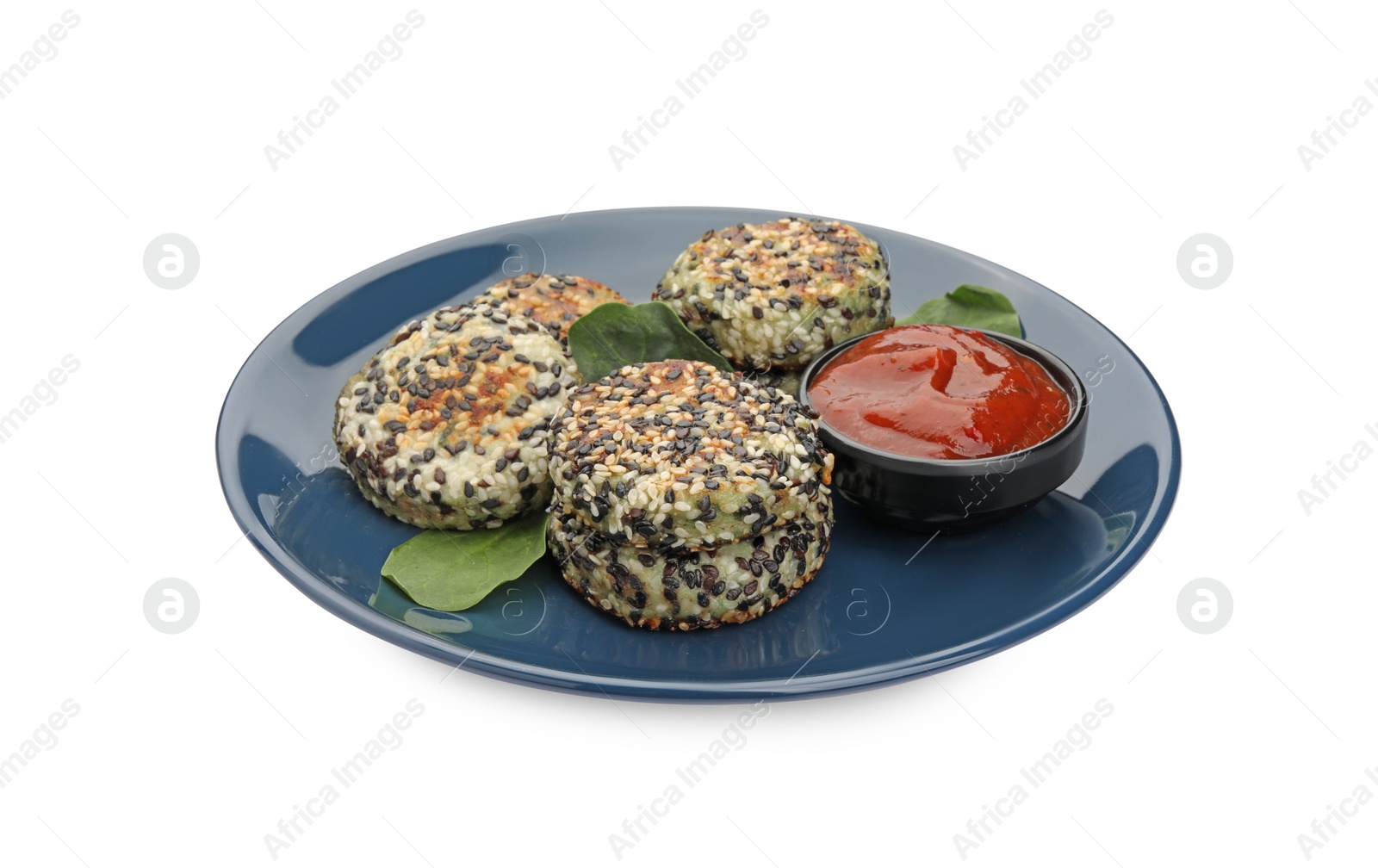 Photo of Plate of delicious vegan cutlets with sesame and sauce isolated on white, closeup