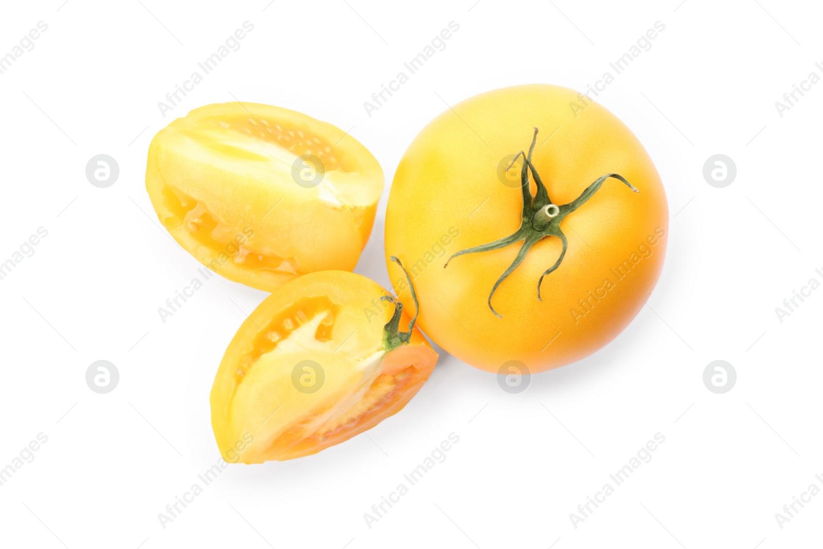 Photo of Cut ripe yellow tomatoes isolated on white, top view