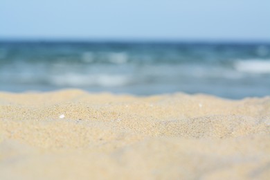 Photo of Beautiful sandy beach near sea, closeup view
