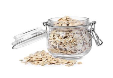 Photo of Raw oatmeal and glass jar on white background