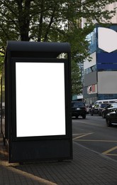 Image of Bus stop with empty signboard in city. Mock-up for design