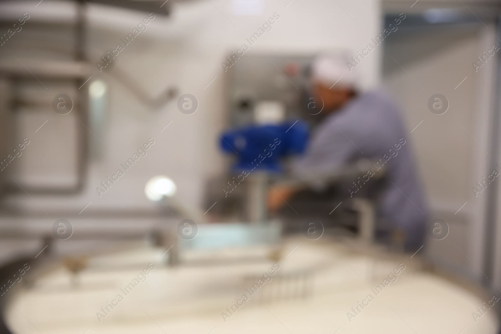 Photo of Blurred view curd preparation tank with milk at cheese factory