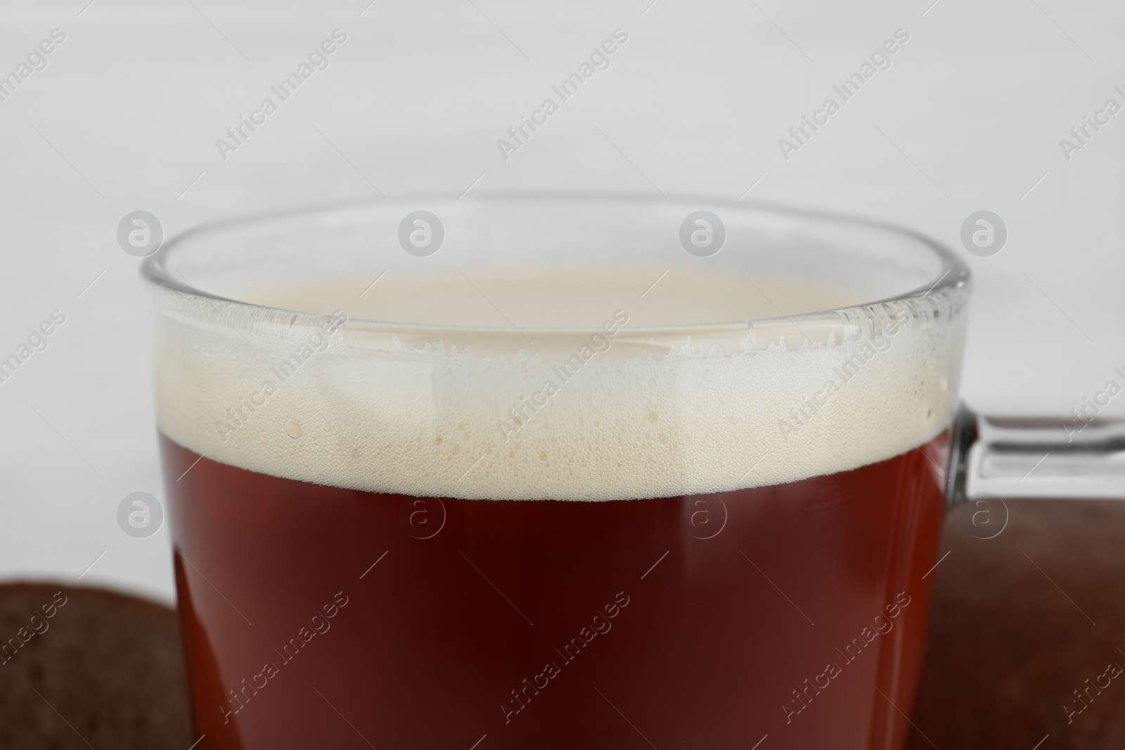 Photo of Glass of delicious kvass on blurred background, closeup