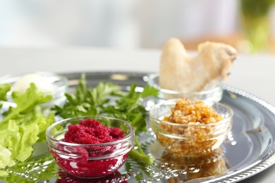 Photo of Symbolic meal on traditional Passover (Pesach) Seder plate, closeup. Space for text