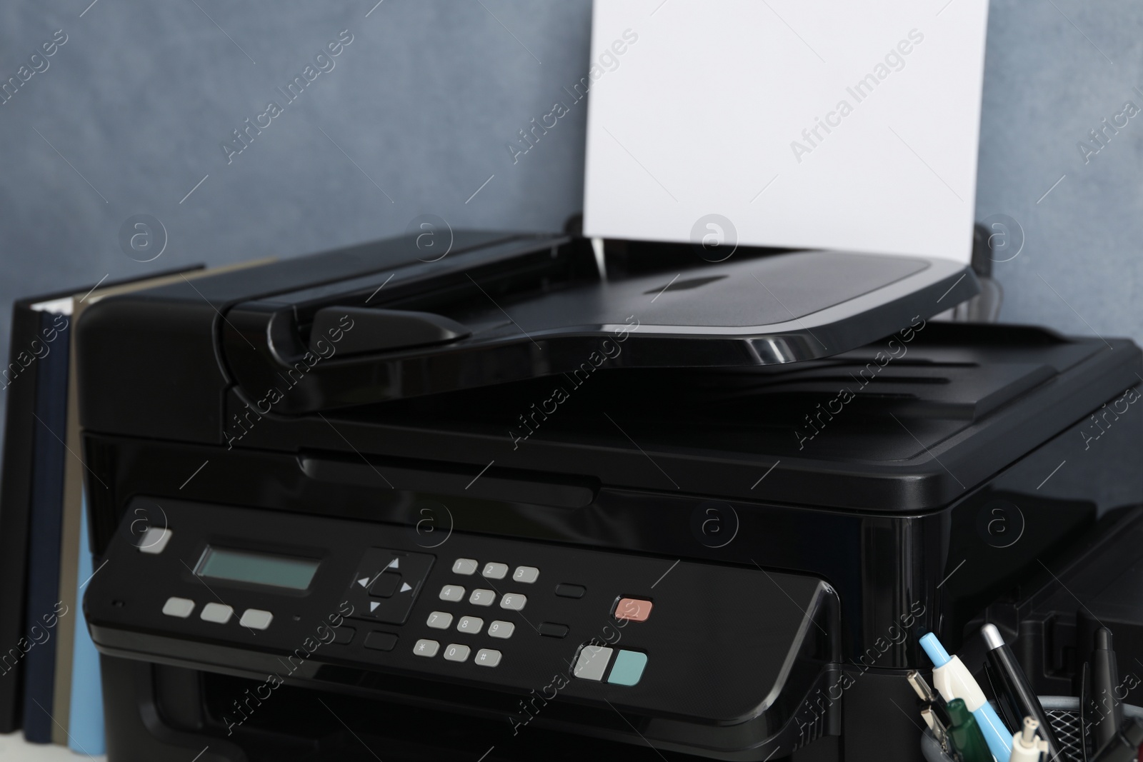 Photo of Closeup view of new modern black printer