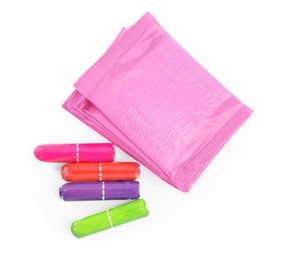 Pads and tampons on white background, top view. Menstrual hygiene product