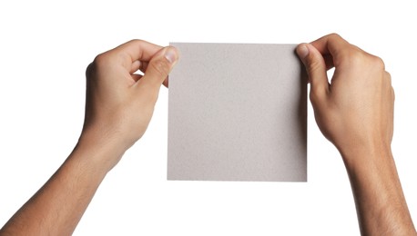 Photo of Man holding sheet of paper on white background, closeup. Mockup for design