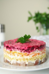 Photo of Herring under fur coat on plate, closeup with space for text. Traditional russian salad
