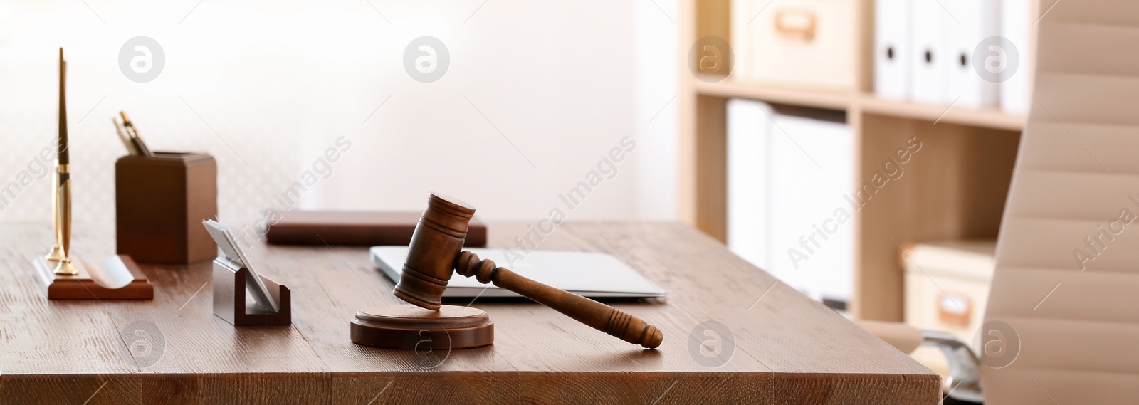 Image of Table with judge gavel in lawyer's office. Banner design