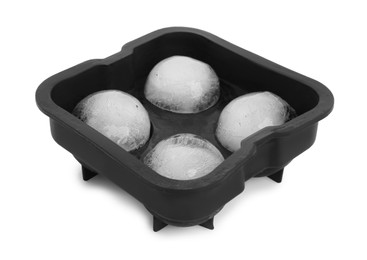 Photo of Frozen ice balls in mold on white background