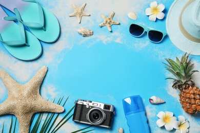 Flat lay composition with beach accessories on color background, space for text