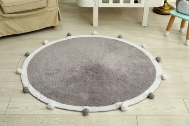 Stylish soft rug on floor in room