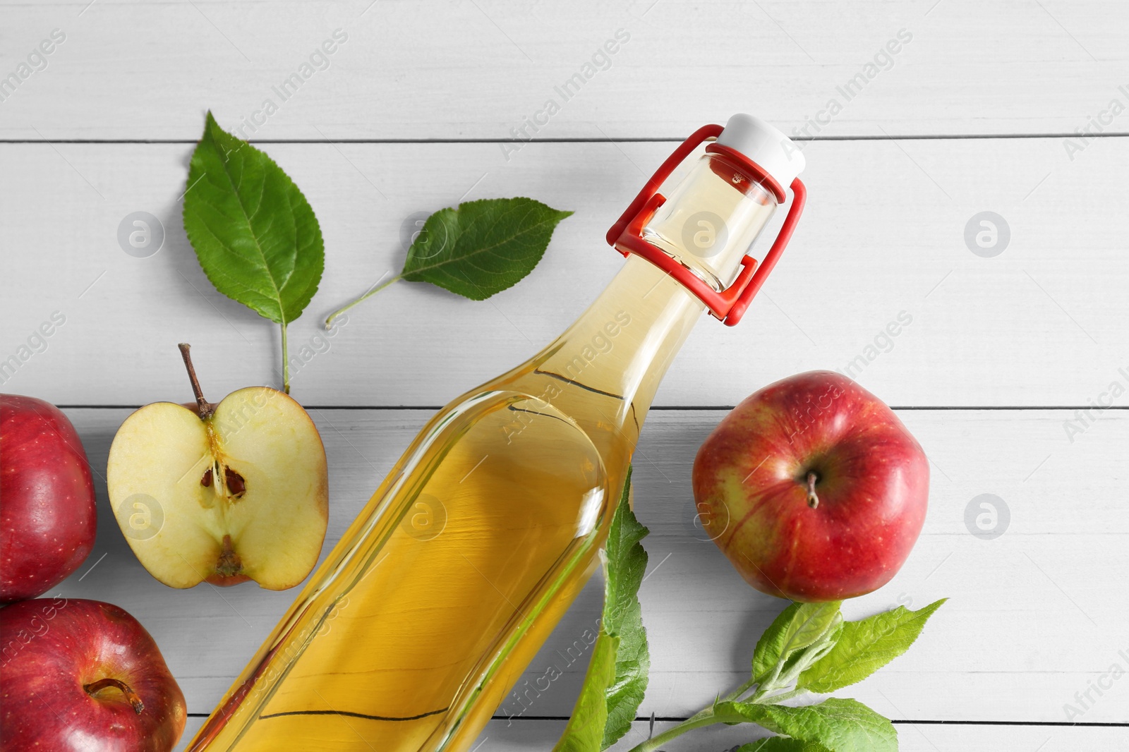 Photo of Flat lay composition with delicious apple cider on white wooden table