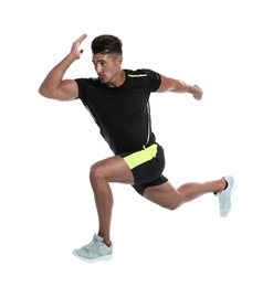 Sporty young man running on white background