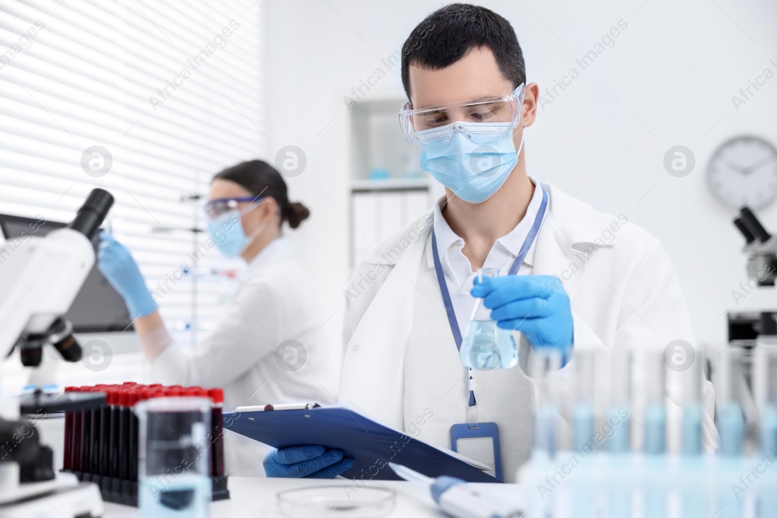 Photo of Scientists working with samples in laboratory. Medical research