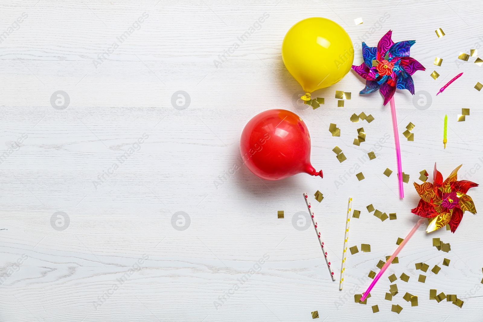 Photo of Flat lay composition with party decor and air balloons on wooden background