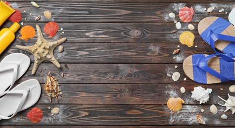 Photo of Stylish flip flops and beach objects on wooden background, flat lay. Space for text