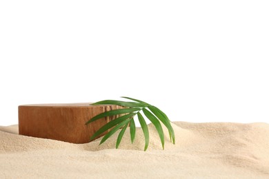 Photo of Presentation of product. Wooden podium and palm Leaf on sand against white background