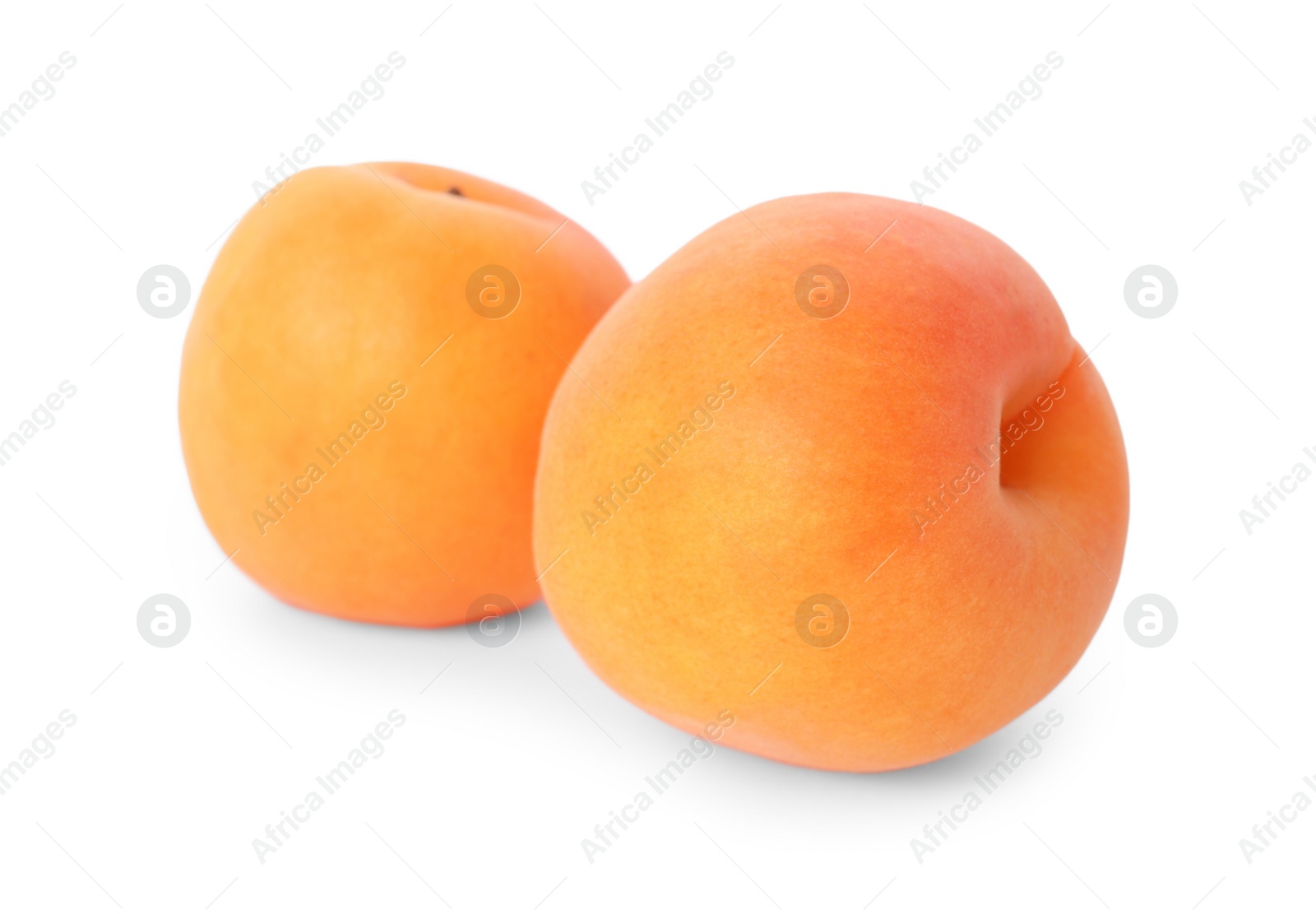 Photo of Delicious ripe sweet apricots isolated on white