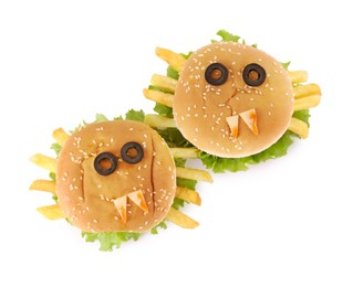 Photo of Tasty monster sandwiches for Halloween party isolated on white, top view