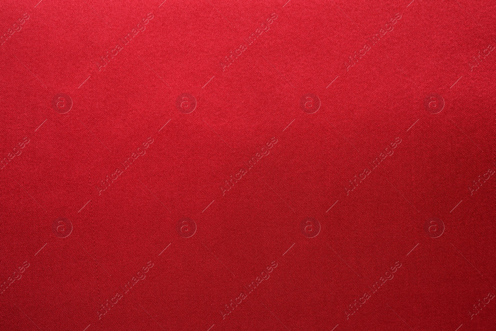 Photo of Texture of beautiful red silk fabric as background, closeup