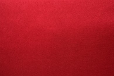 Texture of beautiful red silk fabric as background, closeup