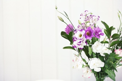 Photo of Bouquet of beautiful flowers on blurred background. Space for text