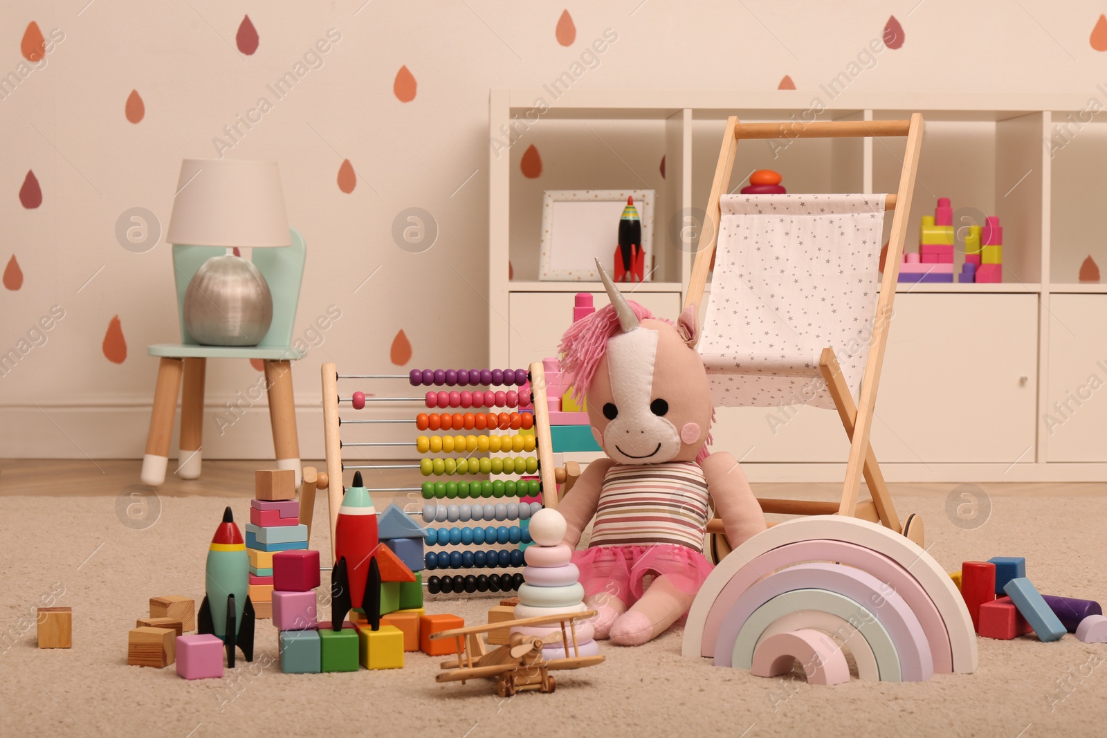 Photo of Many different toys on floor in child's room